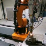 Fixing Gears Economically with DED and Robots